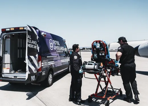 A Royal Ambulance crew preparing a patient for transport.